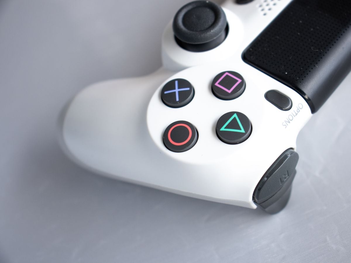 TechlusiveOFCL's tweet card. The PlayStation Black Friday Sale is live in India with huge discounts on PS5, controllers, and top games. Here are the five must-buy titles available at their lowest prices.