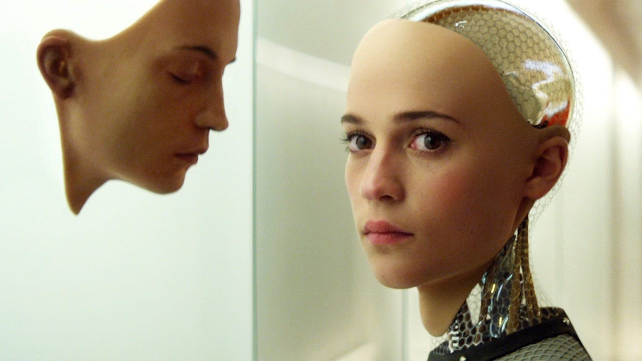 IGN's tweet card. Scientists have invented a "living" human-like skin for robots that is water-repellent, self-healing, and has a realistic fleshy appearance.