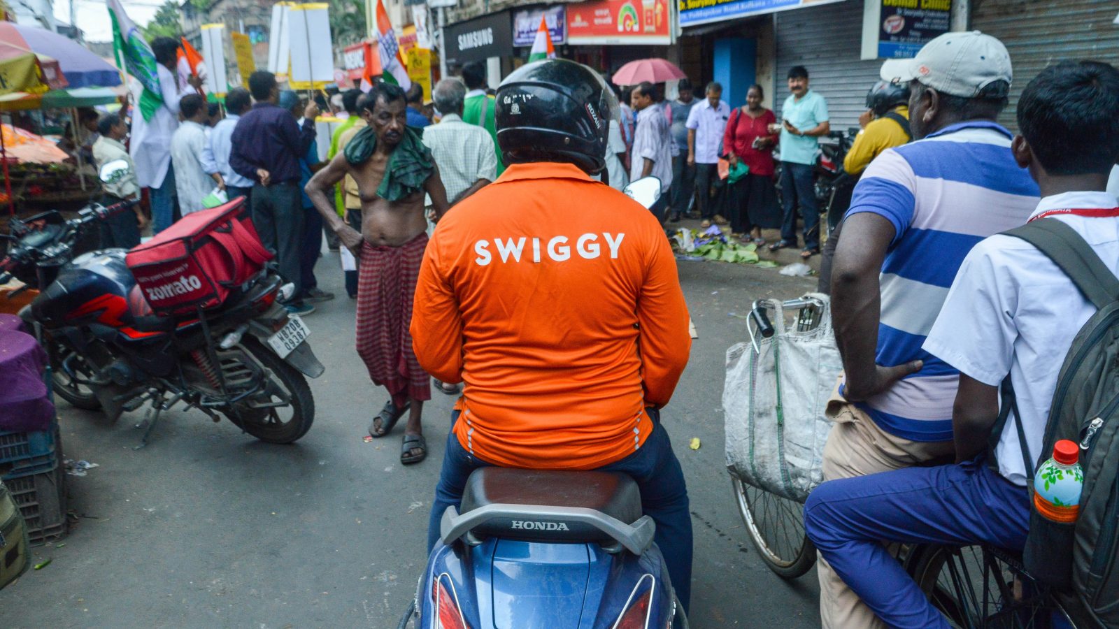 VarshaaBansal's tweet card. Rest of World spoke with 40 riders for Swiggy in India. Many described losing coverage when they needed help the most.