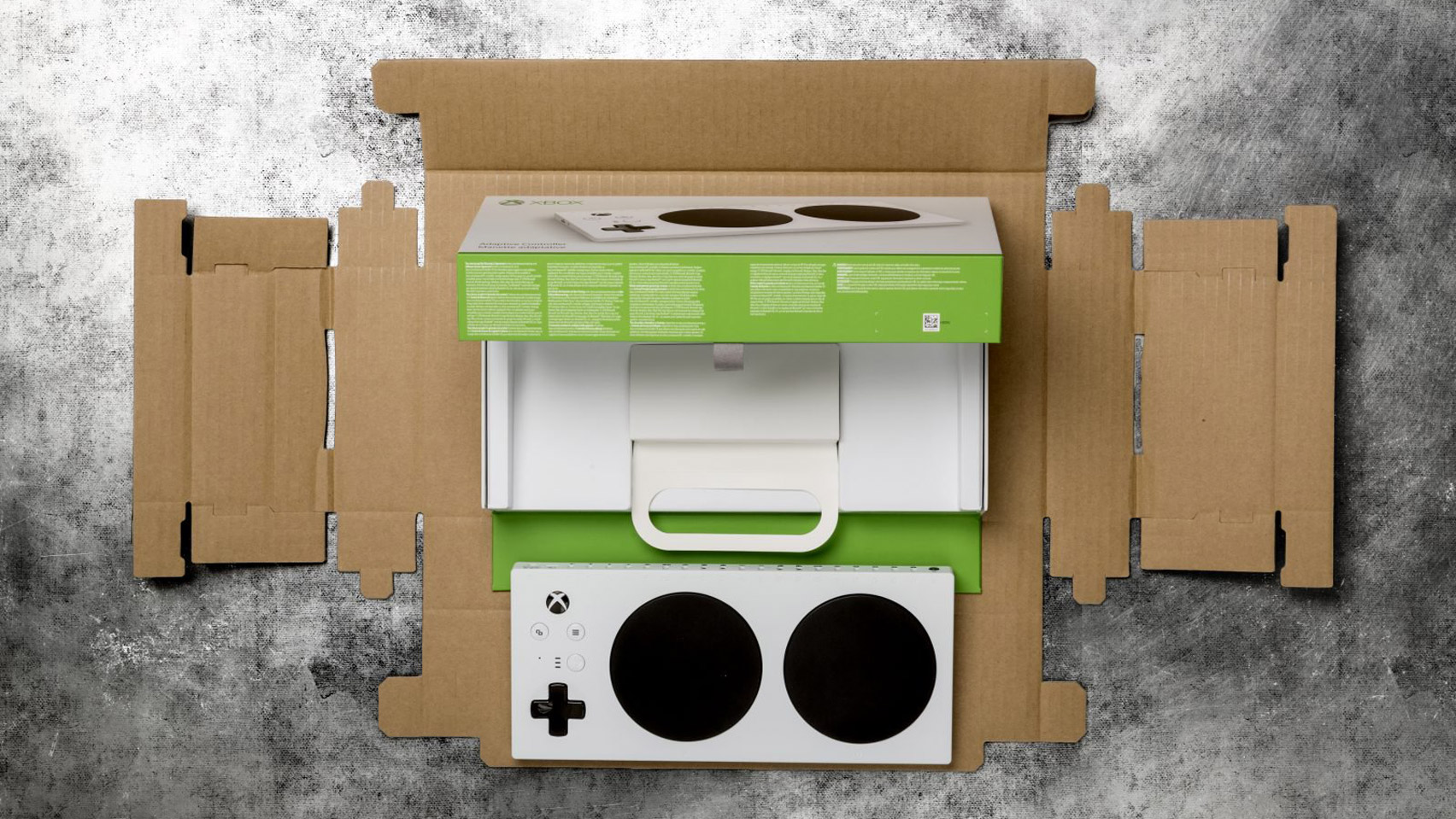 tiltedstudio's tweet card. Microsoft has rethought the packaging design for its Xbox Adaptive Controller, in a bid to make it easier to open for gamers with limited mobility.