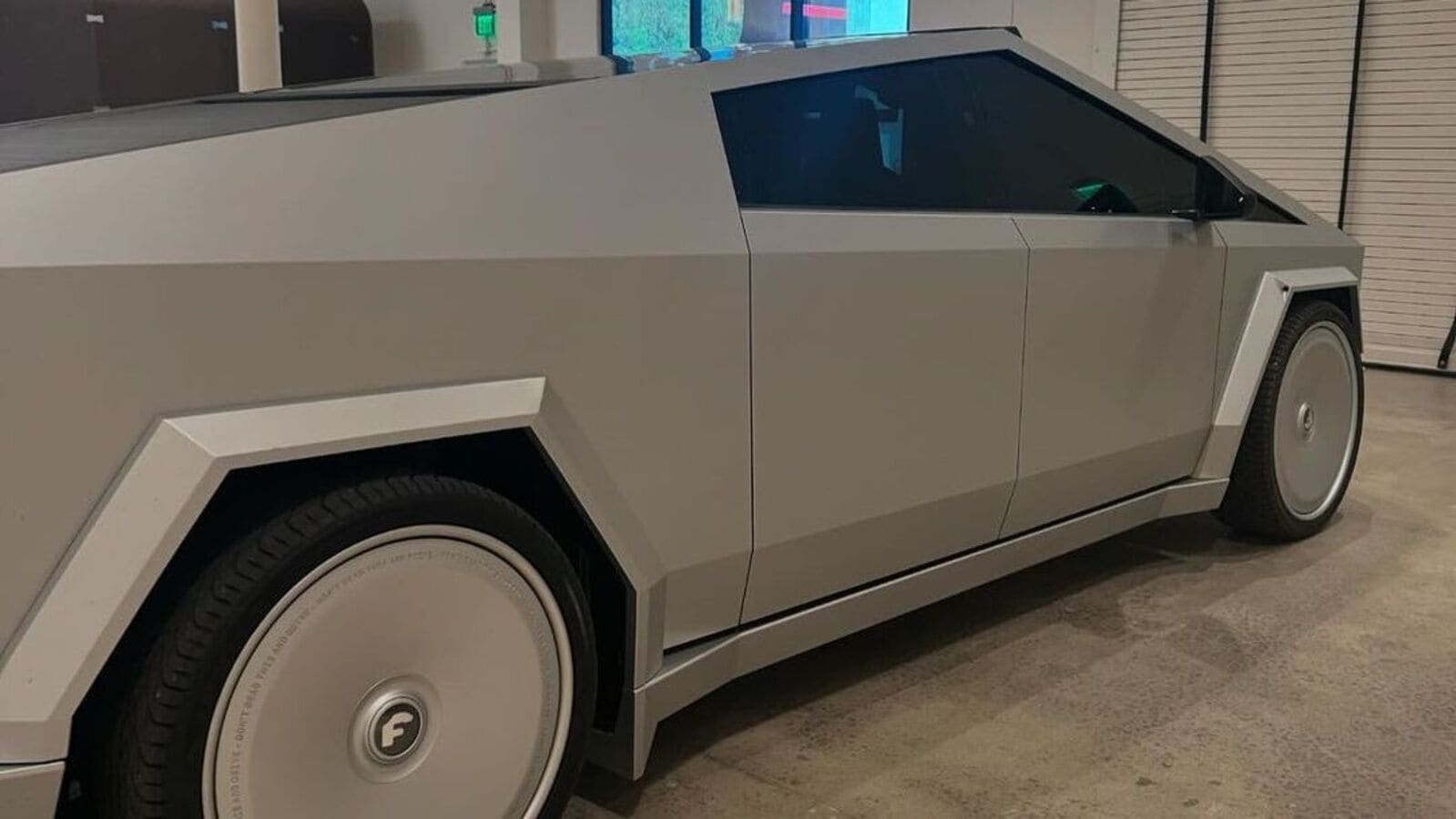 HTAutotweets's tweet card. Kim Kardashian has customized her Tesla Cybertruck with a matte grey paint job, deviating from its standard stainless steel exterior. She paired it with 26-inch Forgiato wheels, joining her extensive...