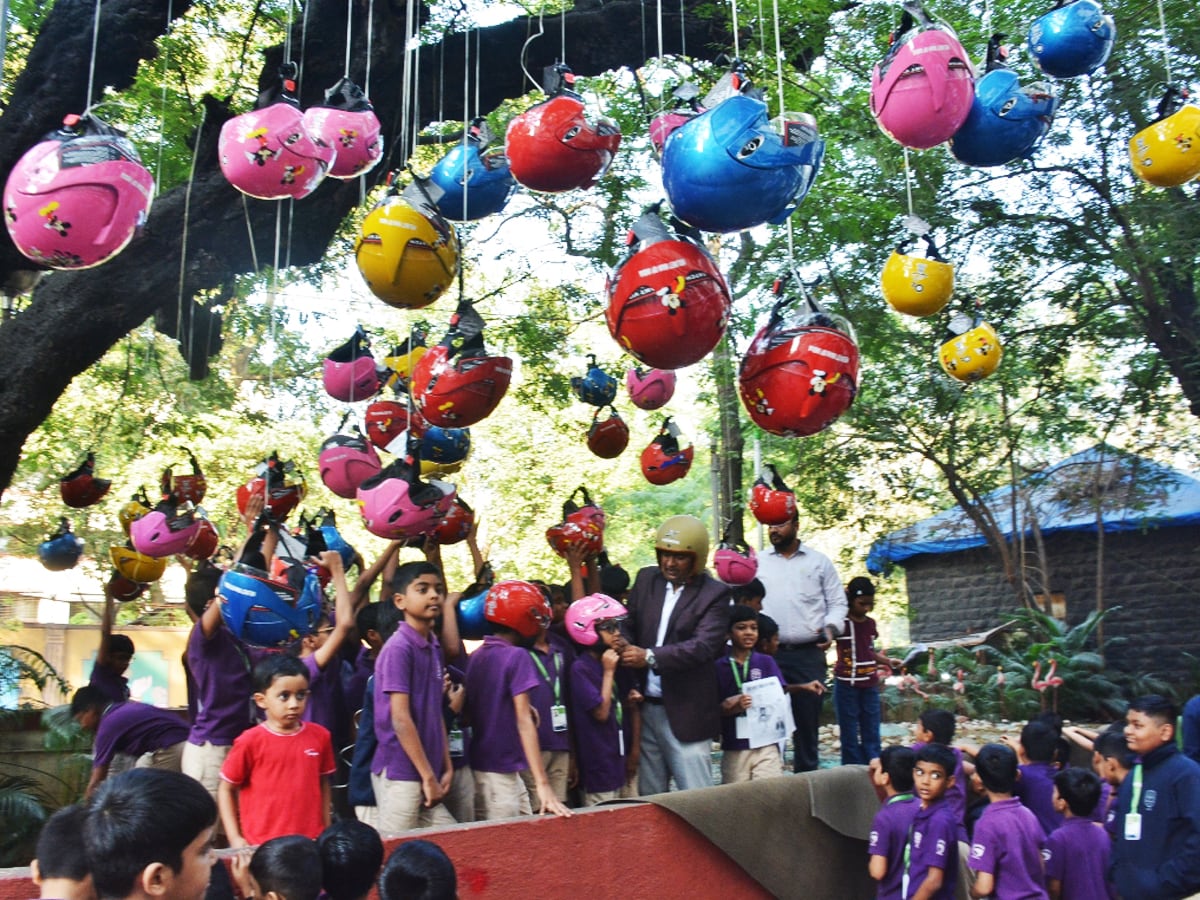helmet_man_'s tweet card. Helmet Man of India Raghavendra Kumar and his team organized helmet distribution to school students to create to create awareness about road safety and helmets among people from a young age at Thane...