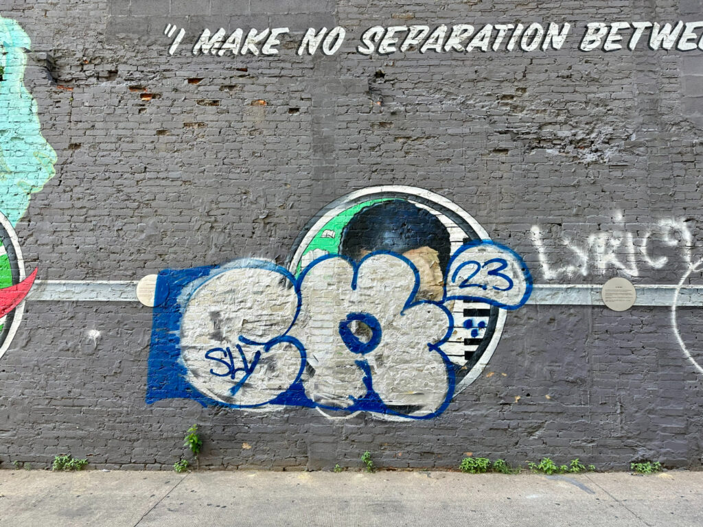 DCist's tweet card. The lead artist behind the mural says this isn't the first time someone has sprayed over his team's work and they plan to repair it.