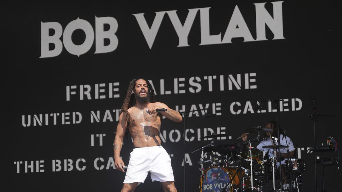 the_hindu's tweet card. Controversial rap punk duo Bob Vylan sparks outrage at Glastonbury Festival with anti-Israel chants, facing police investigation.