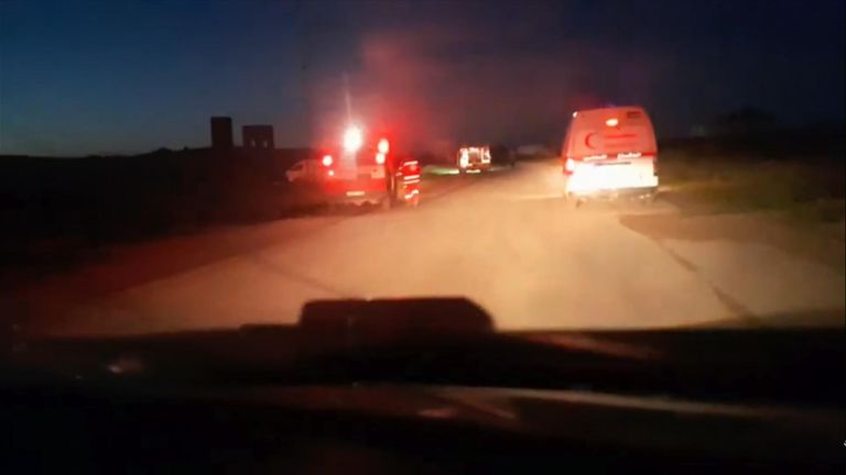 SkyNews's tweet card. The bodies of 15 aid workers were found in a "mass grave" after the incident.