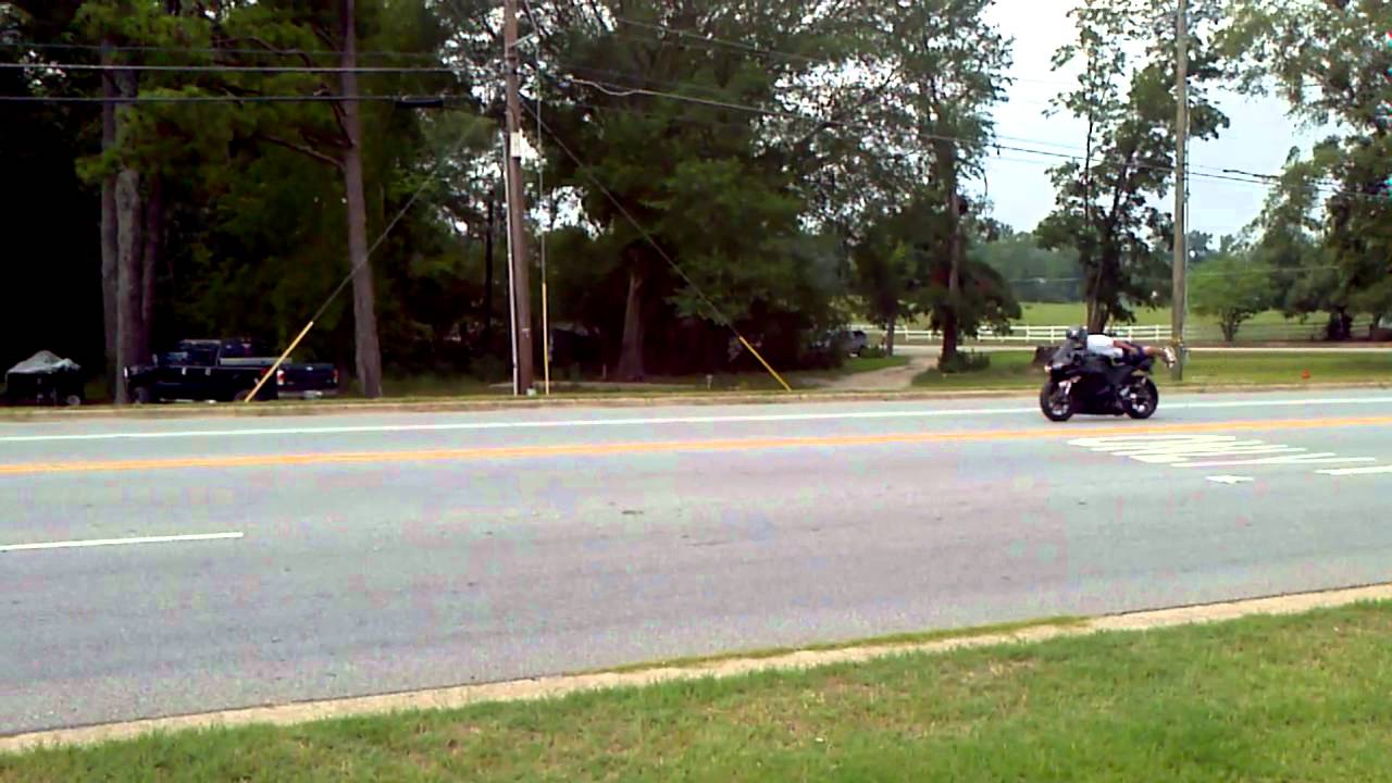 ericmpls's tweet card. Planking on a Motorcycle