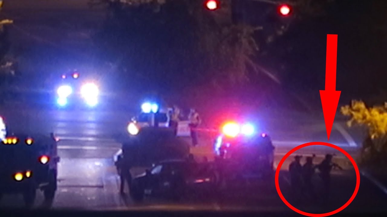 RomanAtwood's tweet card. POLICE SHOOTOUT CAUGHT ON CAMERA!!