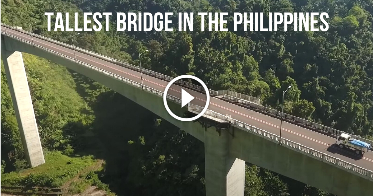 ProjectLUPAD's tweet card. Take an aerial view of Agas-Agas Bridge in Southern Leyte, the tallest bridge in the Philippines with a depth of 89 meters from the bottom of footings to the top roadway. The Agas-Agas Bridge The...