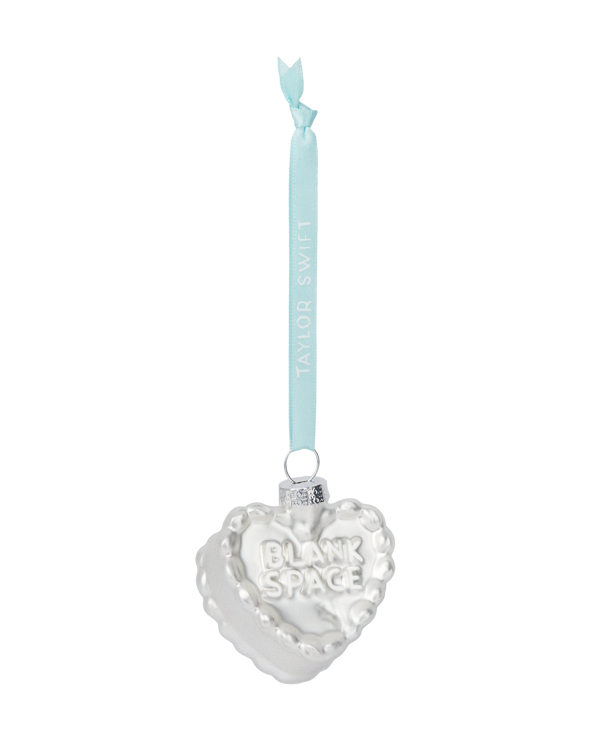 AlertsForMerch's tweet card. Glass white heart-shaped cake ornament featuring "Blank Space" song lyrics embossed on top and "Taylor Swift" logo printed on blue ribbon.Glass2"Limit 4 per order.Taylor Swift®©2025 TAS Rights...