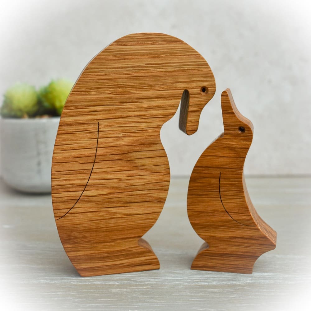 wjneedlework's tweet card. A pair of wooden penguins that have been cut from Oak using a scroll saw and then coated with mineral oil and beeswax to give a nice finish to the wood.  The large penguin measures H13.5cm x W7.5cm x...