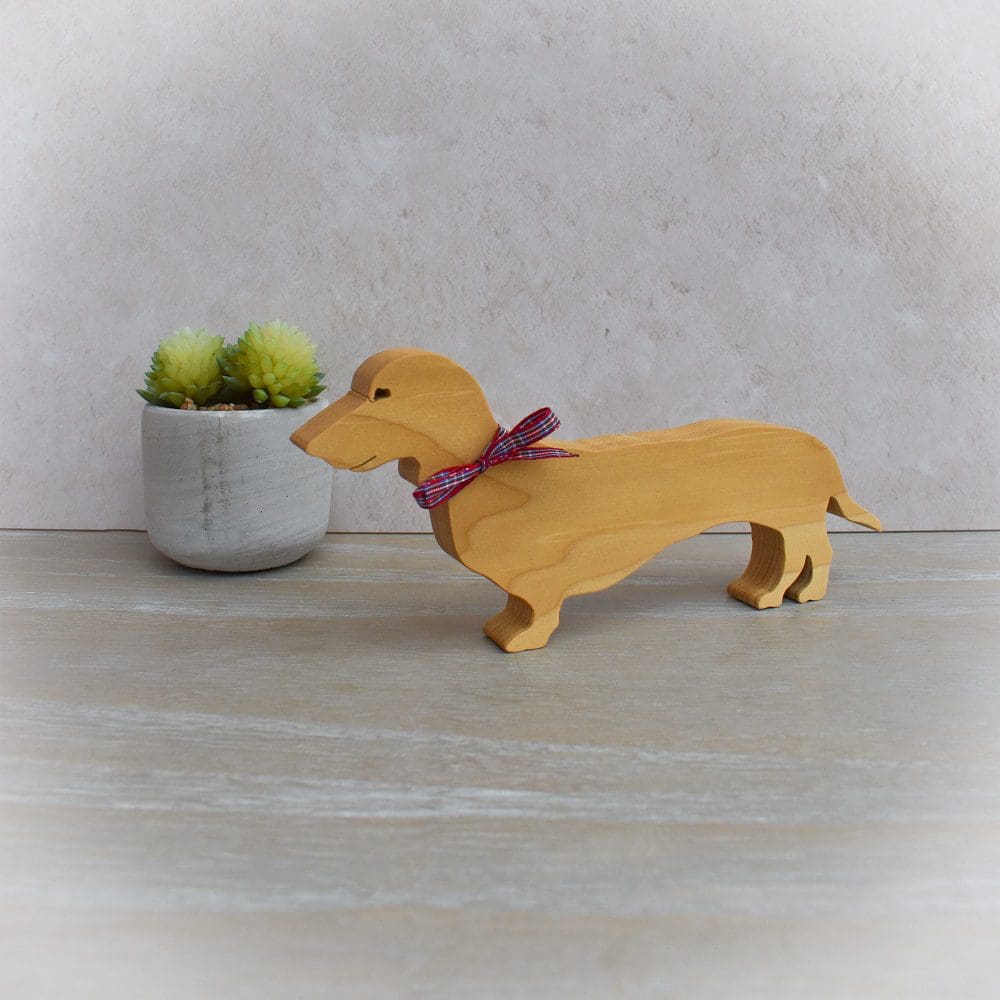 craftednotebook's tweet card. Dachshund Ornament - this lovely little Dachshund has been hand-cut from tulip wood using a scroll saw and then coated with mineral oil and beeswax. Our little Dachshund comes complete with a smart...