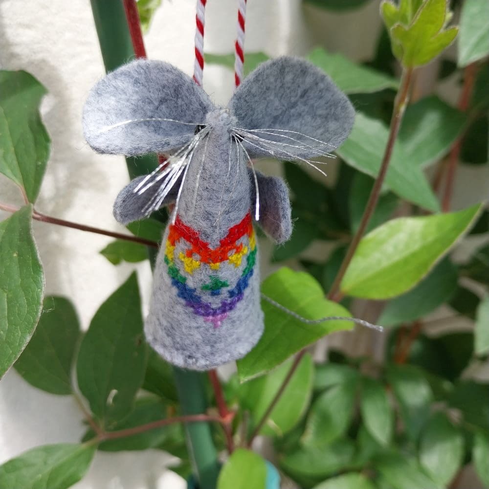 ScrollOnDesign's tweet card. Handmade Felt Rainbow Heart Mouse – Embroidered with Sparkly Silver Whiskers & Tail – Cute Display Ornament This handmade felt mouse features a rainbow heart cross stitch design, hand-embroidered for...