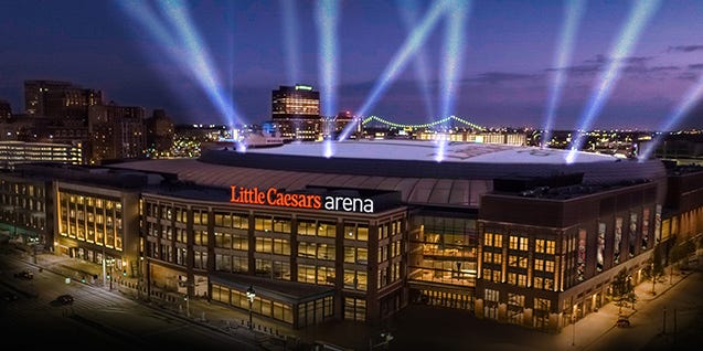 NolanFinleyDN's tweet card. "The Ilitches promised Detroit would see The District rising with the arena, giving the city a vibrant link between downtown and Midtown"