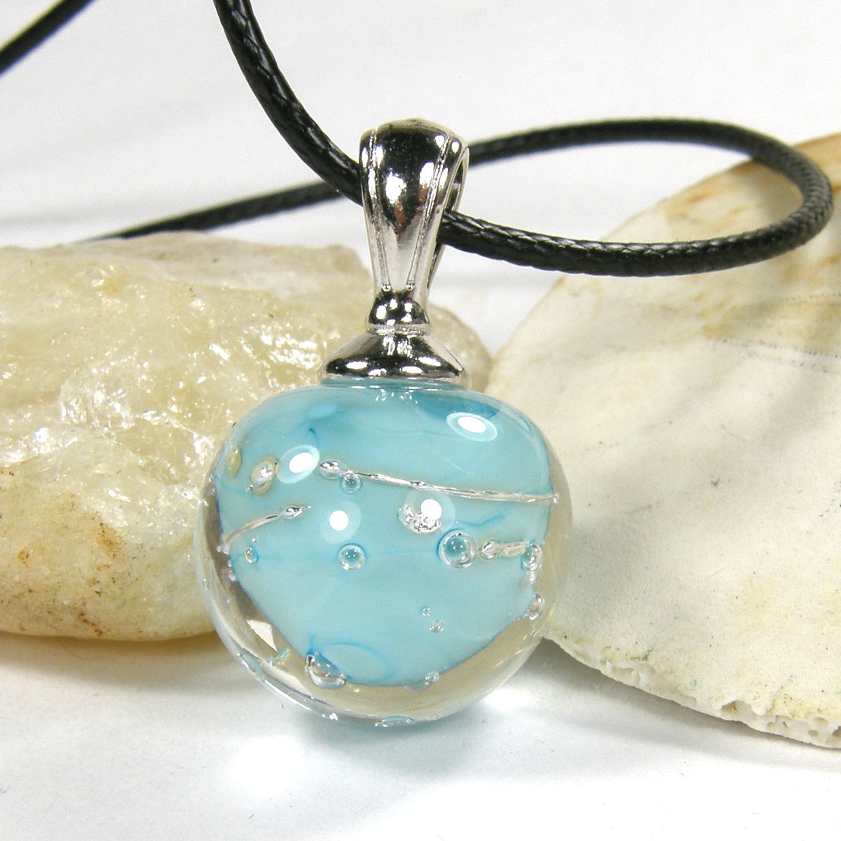 AndreaDesigns1's tweet card. Sky Blue High handmade lampwork pendant necklace.  It features one of my handmade lampwork galaxy globe beads.  It is finished off with a rhodium plated large hole bail.  Strung on a leather neckla...