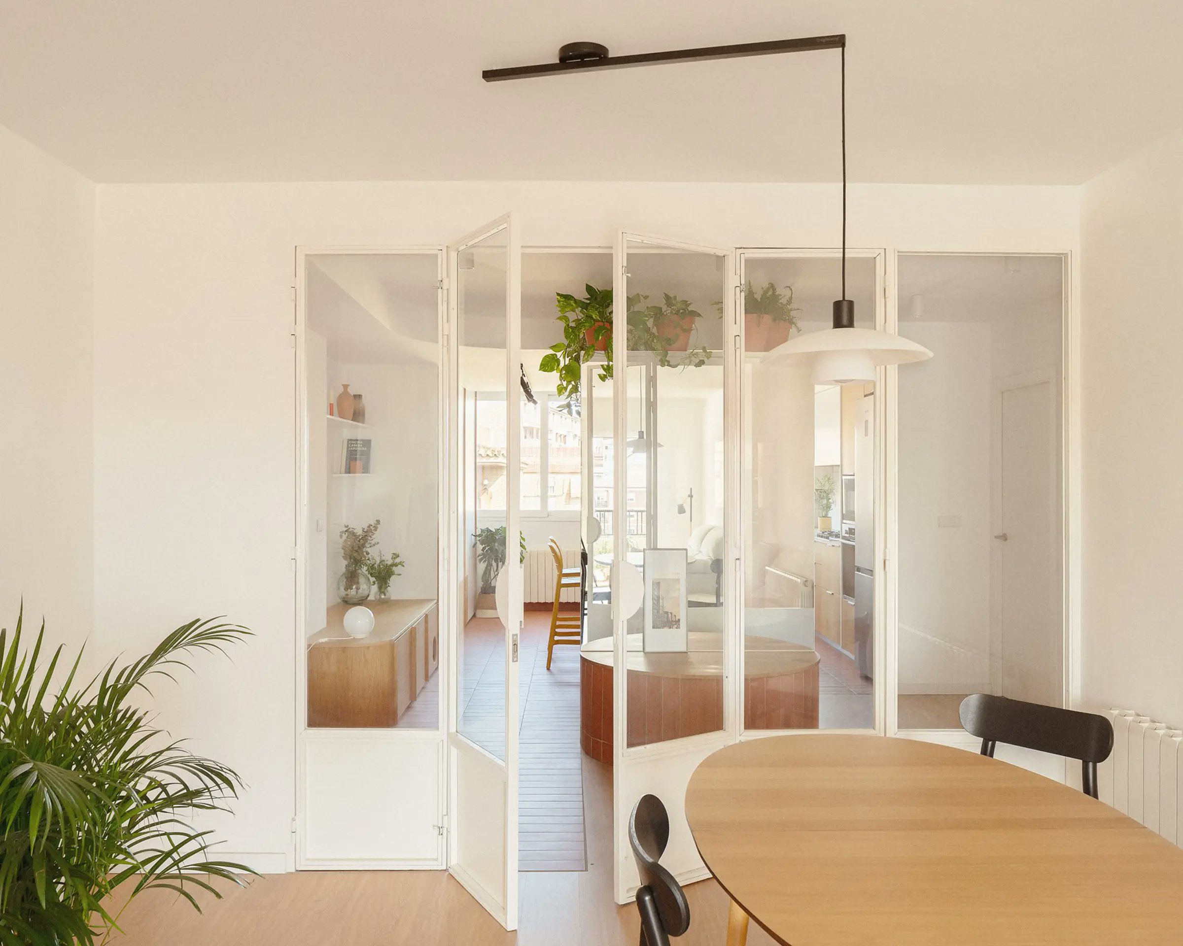 urdesignmag's tweet card. A custom bike storage unit anchors this Valencia apartment renovation. Discover how La Cooperativeta broke its rigid 80s layout.