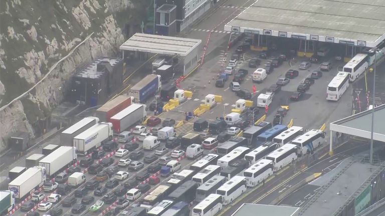 NatalieElphicke's tweet card. A woman travelling on a coach with her family tells Sky News they have been waiting for "12 hours already" and describes the situation as "absolute carnage".