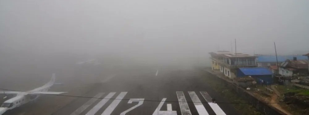 Khabarhub_Eng's tweet card. LUKLA: Flights to Tenzing-Hillary Airport in Lukla, the gateway to Mount Everest, have been suspended for the past three days due to continuous rainfall and fog covering the sky. With flights halted,...