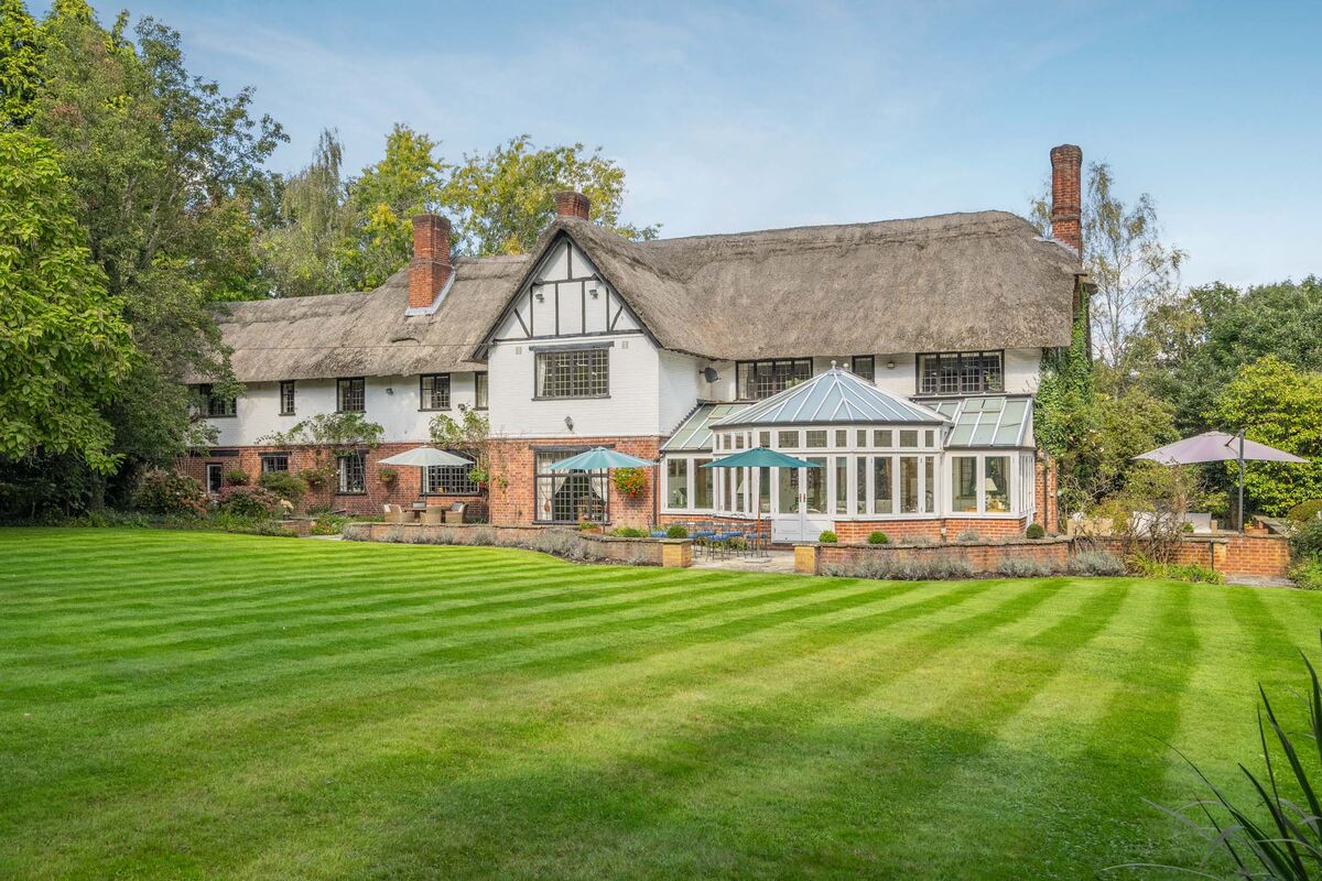 business's tweet card. The home has five bedrooms, a pool, tennis court and party barn and was previously owned by an English football legend.