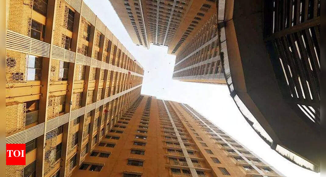 TOIMumbai's tweet card. Clad in a faded purple rida, the traditional dress of the Bohra women, Rashida Saifuddin Kudrati gazes outside the window of her 13th floor room. She