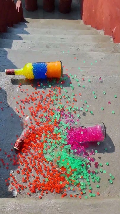 Inmemoryofthet1's tweet card. Colourful glass bottles breaking 🌈 Crushing Crunchy & Soft things🍾...