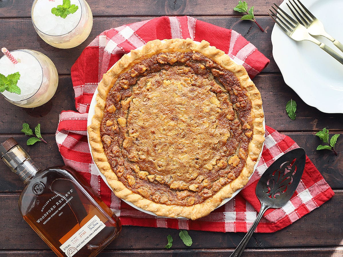 CookingBride's tweet card. Place your bets on this deliciously sweet Kentucky Derby pie filled with semi-sweet chocolate chips, walnuts and a splash of bourbon.