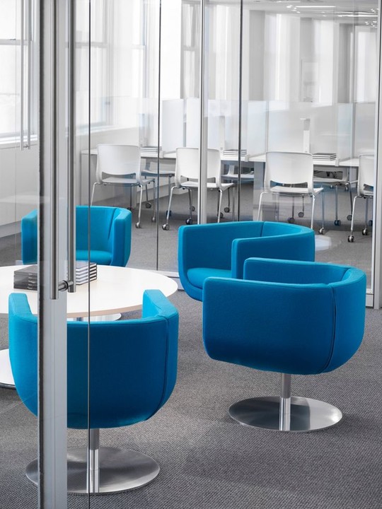 RiversEdge_WS's tweet card. The "pop" of beautiful blue on the Teknion Tulip chair makes this space come to life! In the distance you see Teknion Variable seating and Thesis tables. Teknion Optos architectural glass walls with...