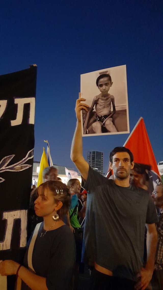 AnarComNet's tweet card. Gaslighting Gaza: Hunger, hypocrisy and history all over again… If media promoted photographs are to be believed, crowds of desperate Palestinians surrounding aid convoys in the Gaza Strip have now…