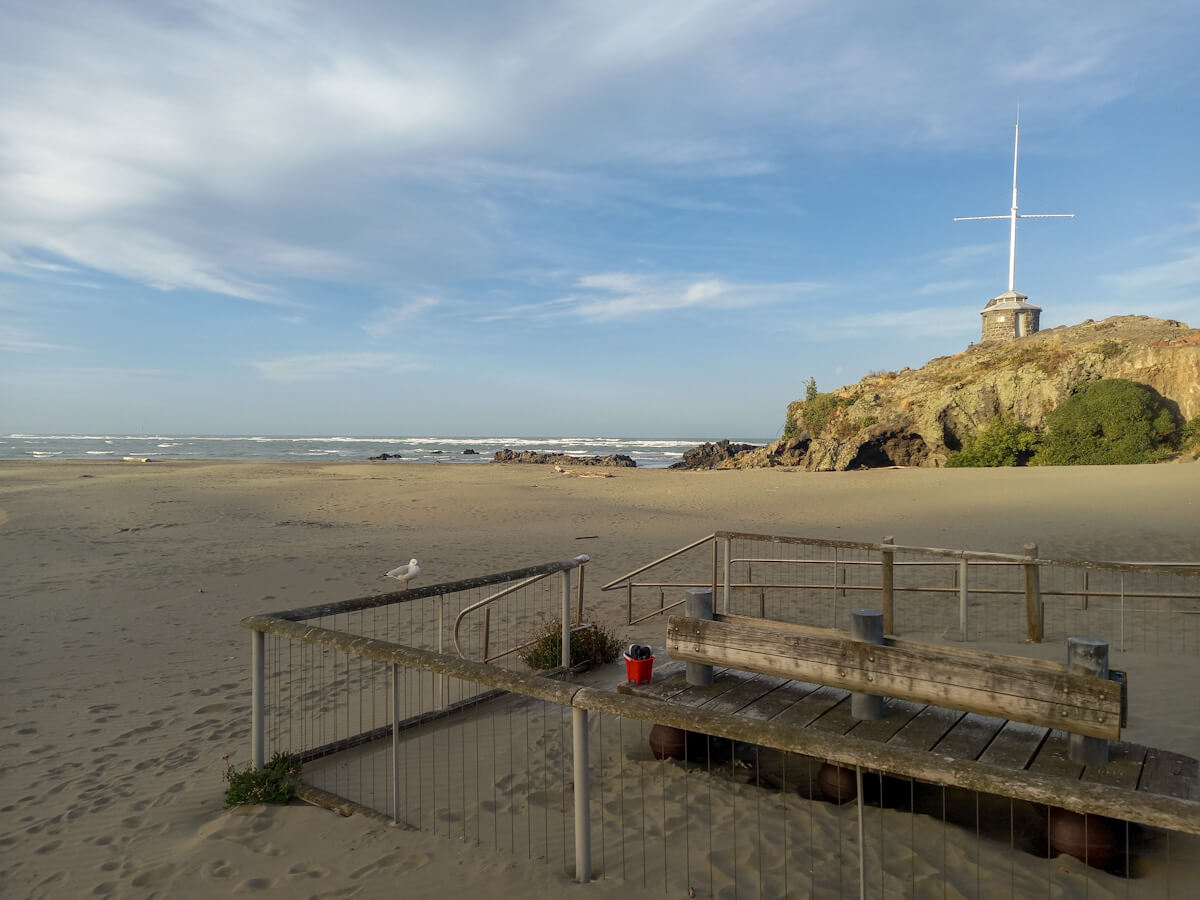 TravelBugsWorld's tweet card. Seaside walks and cafes to Cave Rock; discover cool things to do in Sumner, New Zealand, & why Sumner Beach is the best beach in Christchurch