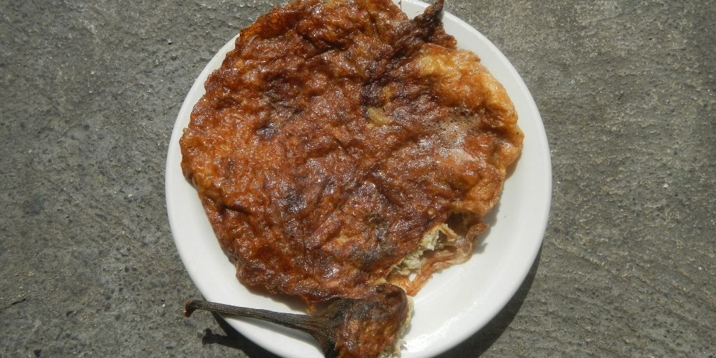 YummyEasy's tweet card. Tortang Talong (eggplant omelet) is a fritter from Filipino cuisine made by pan-frying grilled whole eggplants dipped in an egg mixture.