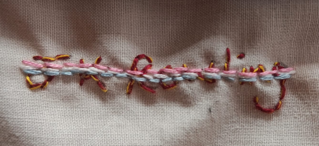 nickwallis's tweet card. UPDATE 3 June 2025: the artwork has now been completely covered over. Full story here. JK Rowling’s name, over-stitched with pink and blue thread. Photo copyright WRN Staffordshire and Derbys…