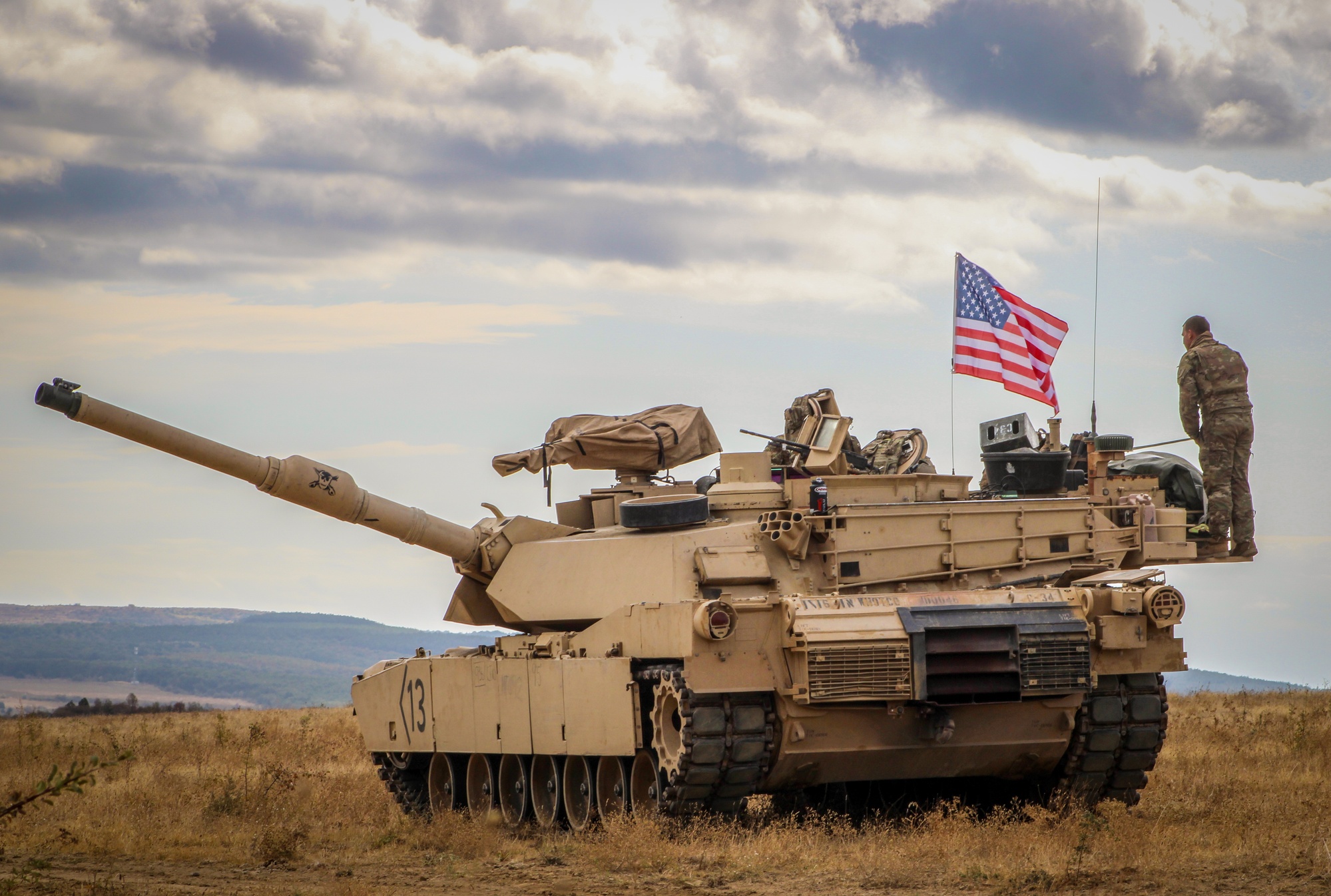 DVIDSHub's tweet card. An M1A2 Abrams crew member from 1-16 Infantry, 1st Armored Brigade Combat Team, 1st Infantry Division prepares his tank for Table III gunnery at Novo Selo Training Area, Bulgaria Sept. 27, 2025. The...