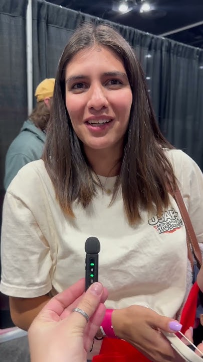 Kinemaniacs's tweet card. Testimonial Sim Gaming Expo 2025 : Woman's Reaction to ARK Dynamics...