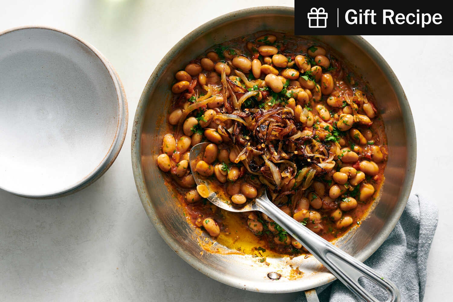 SaraCsit's tweet card. A speedy, pantry-friendly dish, canned white beans braised in olive oil and tomatoes become stewlike and creamy Pinches of fresh or dried rosemary, chile flakes and lemon zest add complexity to the...