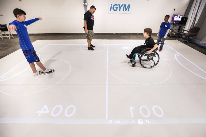 UMengineering's tweet card. U-M-led team to tackle latency for wheelchair-friendly AR/VR soccer matches and large-scale VR word puzzles for players fending off the progression of Parkinson's.