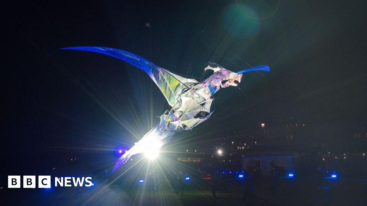 TriggerStuff's tweet card. The Hatchling stands taller than a double-decker bus and is heading to Wakefield in August.