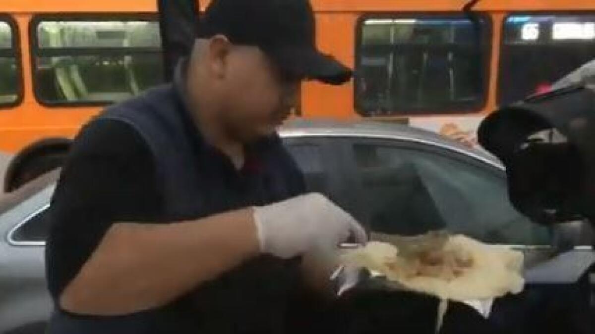 latimes's tweet card. The Los Angeles teachers’ strike began with rain, but at least there was food.