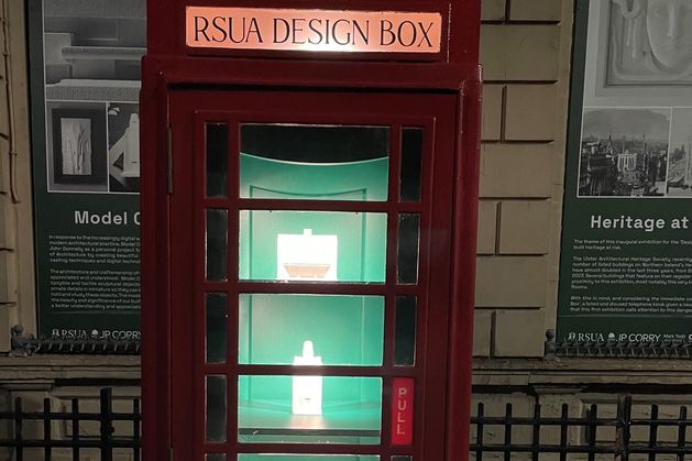ArchitectureNI's tweet card. A disused red phone box in Belfast has become an unlikely exhibition space with a powerful message.
