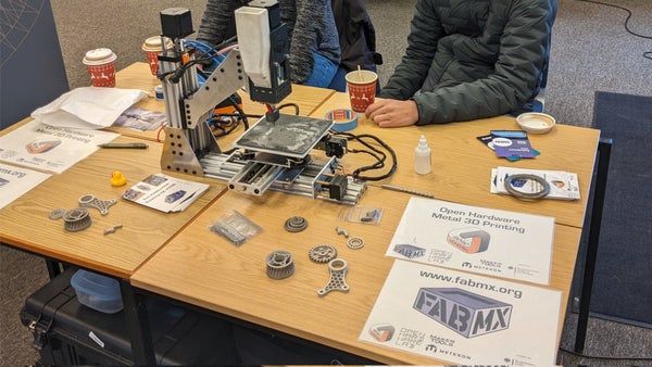 ProjectFabMX's tweet card. Lets learn how to 3D print metal parts! The photograph on this event page is from the FabMX display at the Sanjay Mortimer Rep-Rap Festival last year. The goal of Project