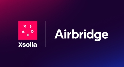 jsabbottcreates's tweet card. A new Xsolla and Airbridge integration links mobile campaigns to web shop purchases, giving developers a unified view of player and revenue data.