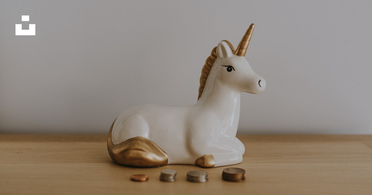 deletec1's tweet card. Unicorn money box and coins stacked – Annie Sprattが撮影したこの写真をUnsplashでダウンロードする