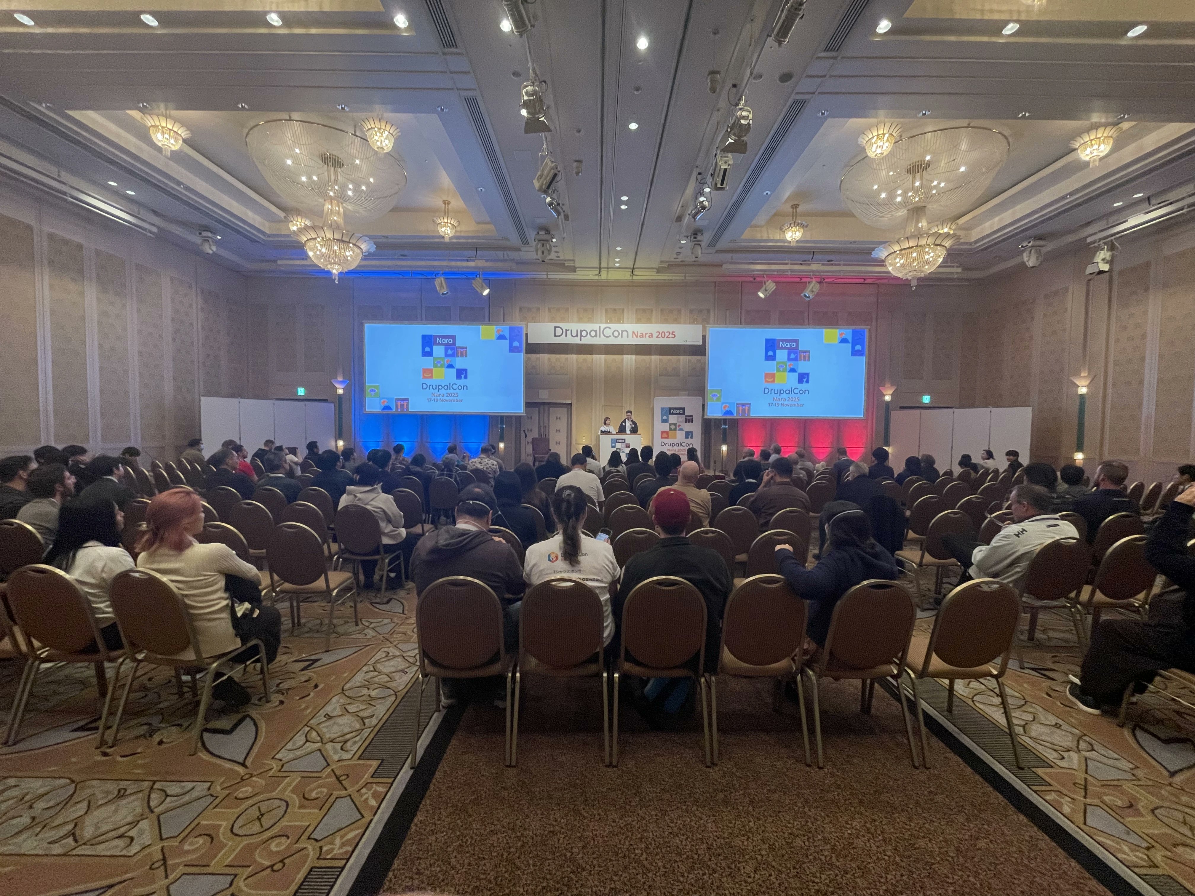 ANNAIInc's tweet card. DrupalCon Nara 2025開催レポート。Drupal創設者Dries Buytaert氏が語った Drupal Canvas、AI統合、サイトテンプレートの展開と5年後のビジョン。シャープのエンタープライズ事例、DrupalMeetup奈良のコミュニティ活動、技術セッションのハイライトを詳細レポート。