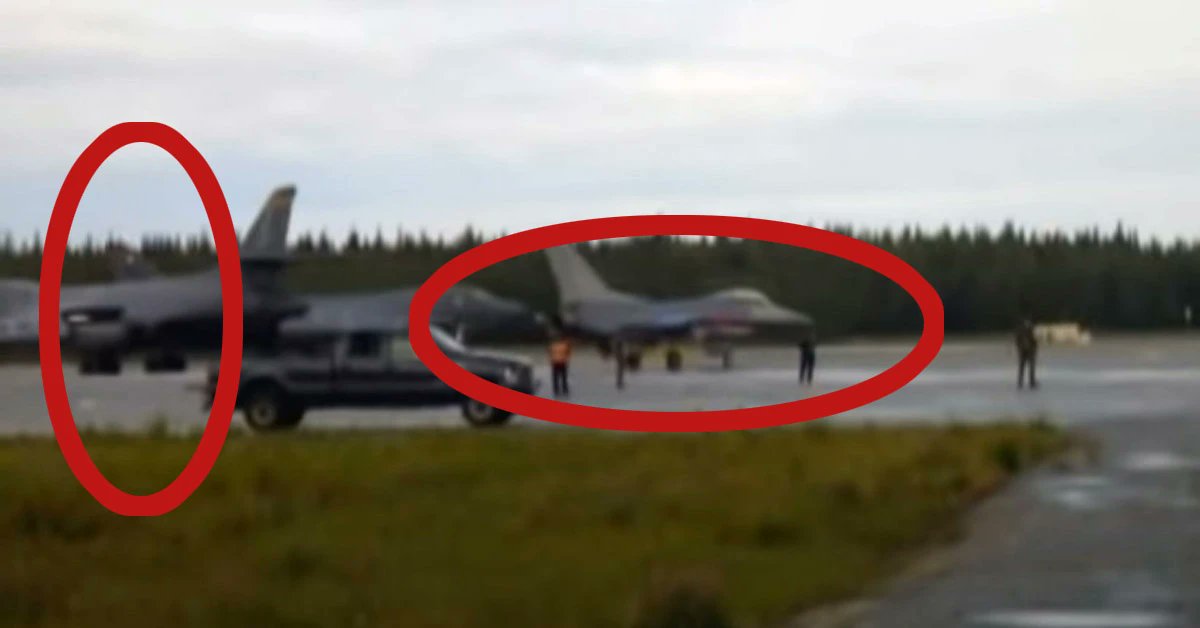 AviationHumor's tweet card. F-16 fighter jet being tipped over by the powerful engine exhaust of a taxying B-1B bomber