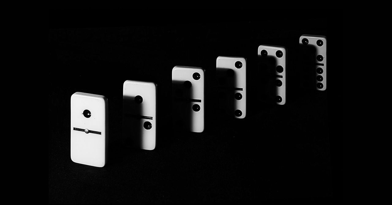 MathnasiumDP's tweet card. Using a small domino to topple a taller one, you could in theory take down a domino the size of a skyscraper. Here's how it would work.