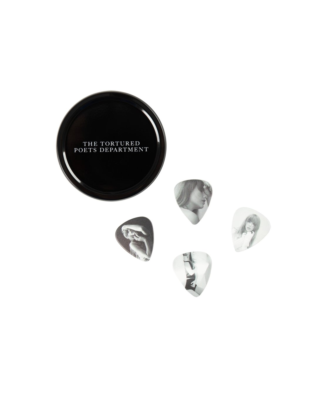 AlertsForMerch's tweet card. Set of 4 guitar picks featuring photos of Taylor Swift on one side and "TTPD" album logo on other side. Includes black tin holder with "The Tortured Poets Department" printed on top and "Taylor...