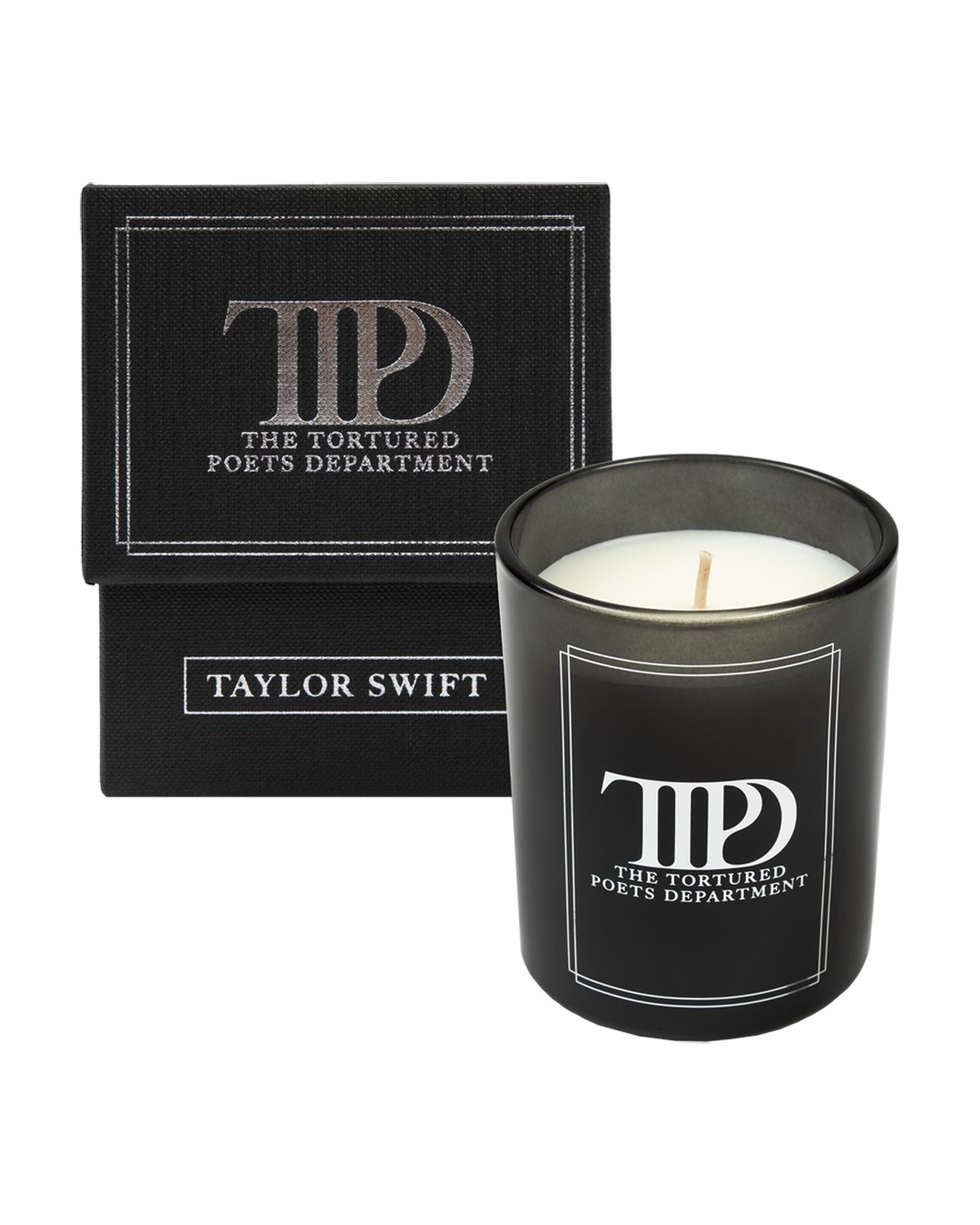 AlertsForMerch's tweet card. 8oz soy candle in black vessel with white wax featuring "TTPD The Tortured Poets Department" and line design printed on front and Taylor Swift in box design on back. Candle features an oud and amber...