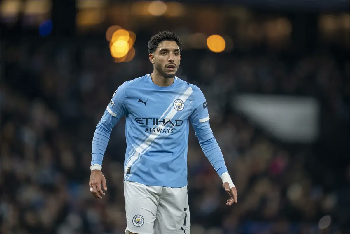 Footiebuzz's tweet card. Manchester City continue to face pressure from the Egyptian Football Association over the release date of Omar Marmoush for the upcoming African Cup of Nations. The situation has escalated with…