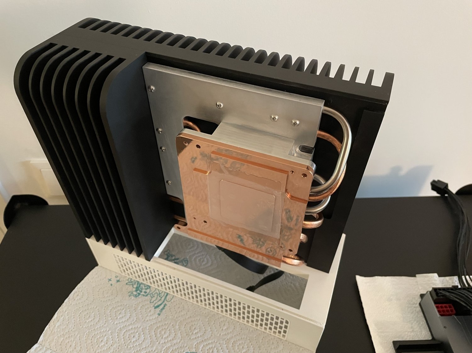 TweakTown's tweet card. This user built himself a custom 7.5L fanless case for AMD's new Ryzen AI Max+ 395 'Strix Halo' APU using the Framework modular Desktop PC.