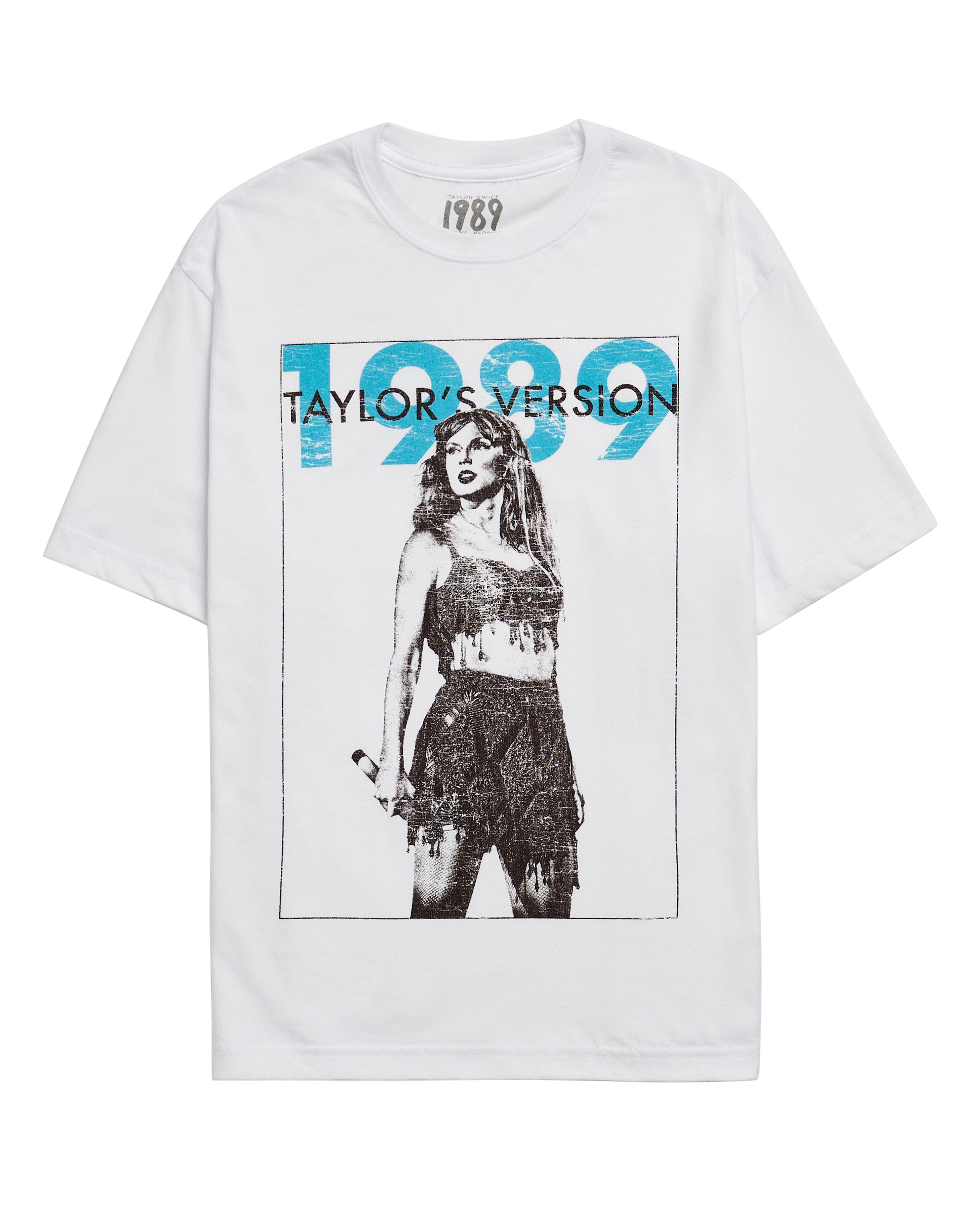 swiftpitch_uk's tweet card. Ships within 10 daysWhite t-shirt featuring "1989 Taylor's Version" album logo with teal accent and distressed vintage graphic of Taylor Swift with black border printed on front.Standard fit.100%...