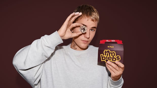 michaelcusden's tweet card. Tim Hortons has teamed up with pop superstar Justin Bieber to launch three new Timbit flavours — called Timbiebs — along with co-branded merchandise.