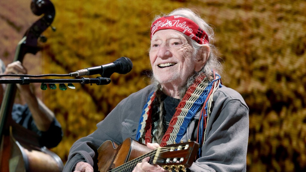 billboard's tweet card. Live Nation will drop merch fees and pay $1,500 to all club acts as part of the "On the Road Again" program inspired by Willie Nelson.